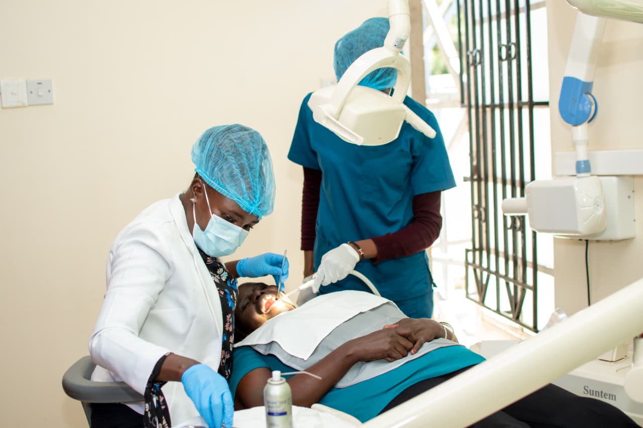 A clean and modern dental treatment room with advanced equipment.