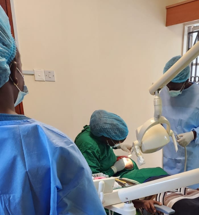 A doctor working on a patient's teeth.