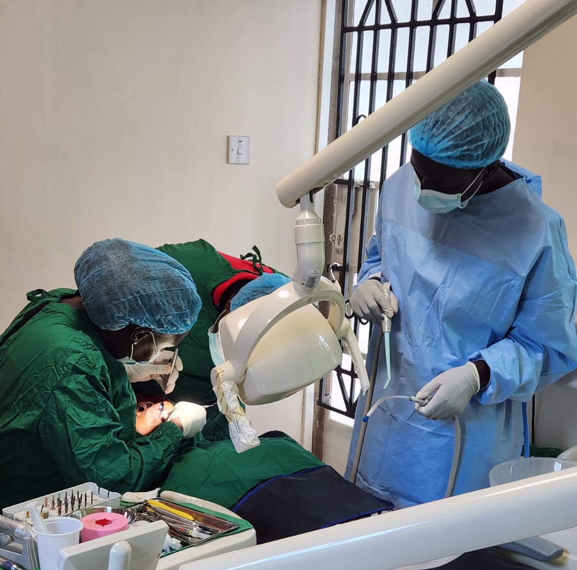 A doctor working on a patient's teeth.